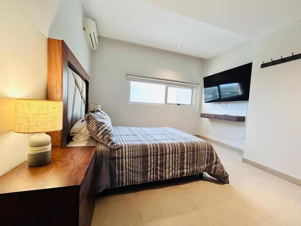 Deluxe Apartment, Balcony, Beach View | Down comforters, in-room safe, soundproofing, iron/ironing board