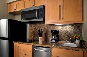 A kitchen with a stainless steel refrigerator, a microwave, a coffee maker, and a knife block on the counter. - ALOHA!! GRAND Ocean view 1-BdRm studio VILLA  on the gorgeous Kaanapail Beach (Lahaina)