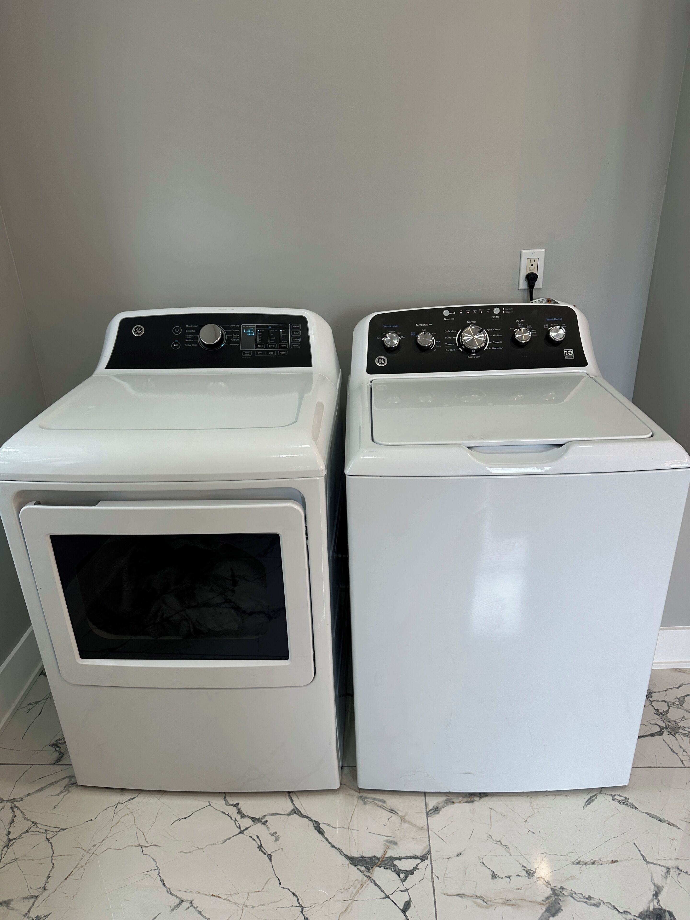 Two front-loading washing machines side by side.