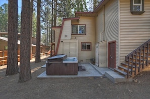 A two-story building with a hot tub in front, surrounded by trees. - Bearwoods Barn W Spa Near Snow Summit (Big Bear Lake)