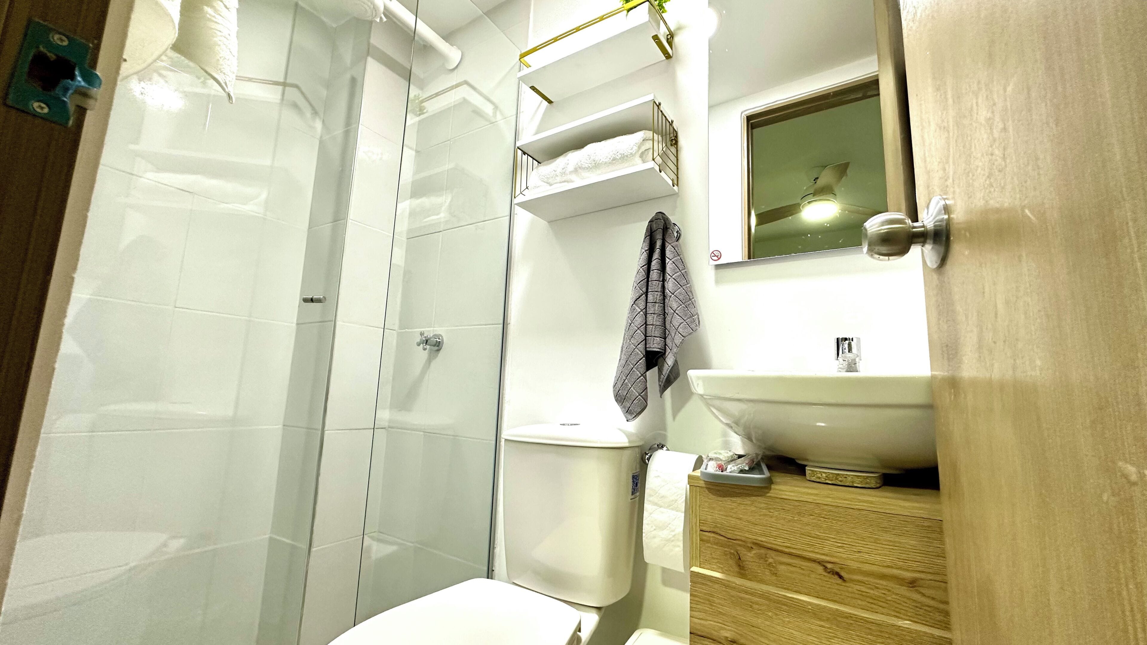 Shower, towels, soap, toilet paper