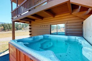 A hot tub in a wooden cabin with a balcony overlooking a mountainous landscape. - 4 Eagles | Hot Tub | South Fork Cabin | Wolf Creek (South Fork)