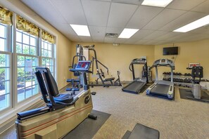 A gym with cardio equipment, weight machines, and dumbbells. - Large Waterfront Townhome with Great Amenities (Ocean City)