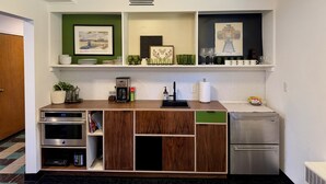 A modern kitchen with a built-in oven, a coffee maker, and a refrigerator. - Lovely 2-bedroom apartment in Anchorage perfect for your getaway (Anchorage)