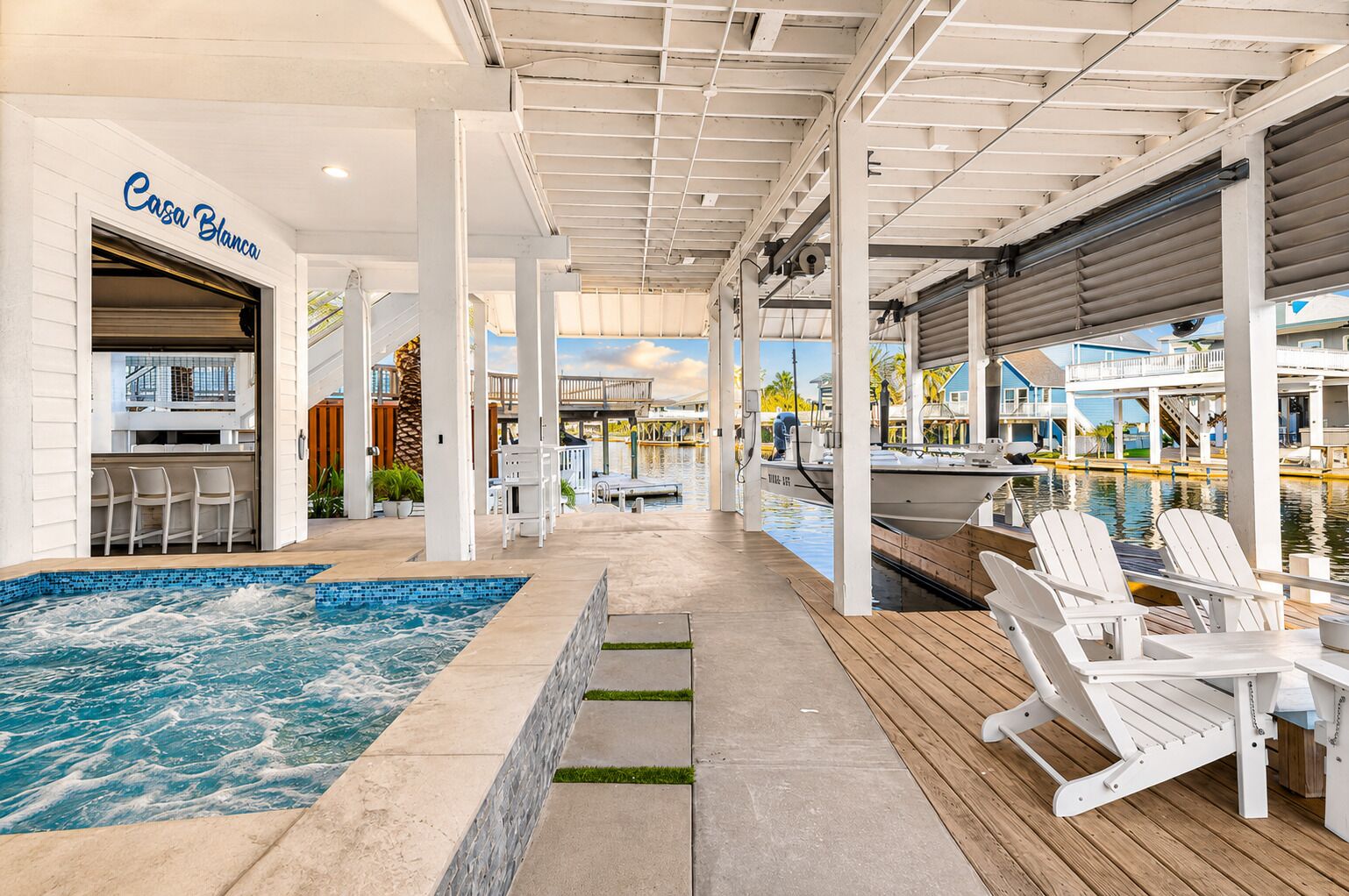 A pool area with a hot tub, lounge chairs, and a bar area labeled 'Casa Blanca.'