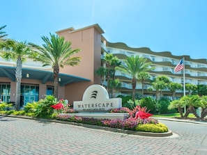 A hotel entrance with a sign reading "WATERSCAPE" and "1100 Santa Rosa Blvd." - 🦩Book Me Baby! Gulf-Front Waterscape B507 Off The Hook🦩 (Fort Walton Beach)