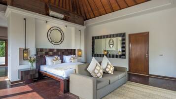 A modern bedroom with a large bed, a sofa, a mirror, and a wooden ceiling.