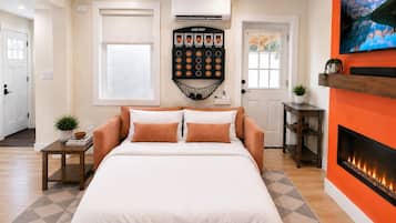 1 bedroom, desk, iron/ironing board, travel crib