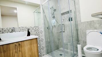 Shower, hair dryer, towels, soap