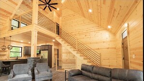 Living area - The Wooded Obsidian Overlook cabin, with hot tub, games, and close to everything (Logan)