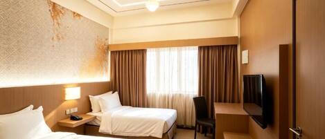 Kamar Twin Deluks, pemandangan kota | Tirai kedap cahaya, setrika/meja setrika, dan Wi-Fi gratis