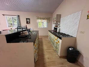 Coffee/tea maker, fridge, stovetop, toaster