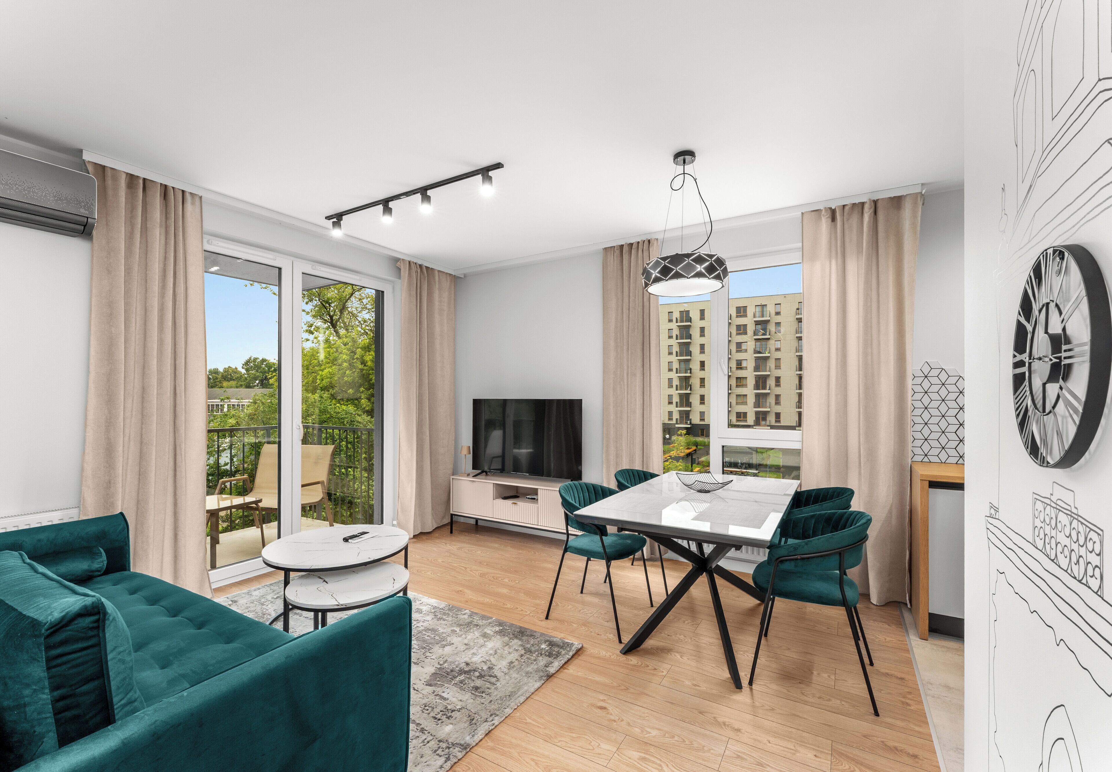 A modern living room with a dining area, large windows, and a view of the cityscape.