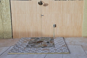 A closed wooden gate with a tiled entrance area. - Your stay, your way, with pool, gym & CalKing Bed. (Phoenix)