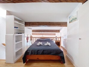 A narrow room with a bed, a white wardrobe, and a wooden ceiling. - La Bressado by Interhome (Saint Cyr sur mer Les Lecques)