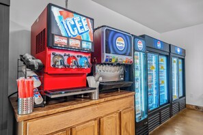A vending machine area with a red ice cream dispenser and a Pepsi refrigerator. - Resort Cabin > Golf Cart! > Hot Tub > Lazy River > Indoor Pool > Shuffleboard (Hollister)
