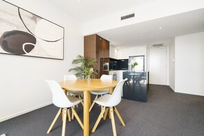 Dining - 1BR Apartment with Balcony, Gym & City Views (Canberra)