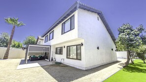 A modern two-story house with a garage, a covered patio, and a well-maintained lawn. - Fully renovated and Spacious 4-bedroom 3 baths house (Upland)