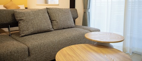 Family Twin Room | Living area | 40-inch flat-screen TV with digital channels