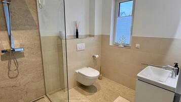 Shower, hair dryer, towels, soap