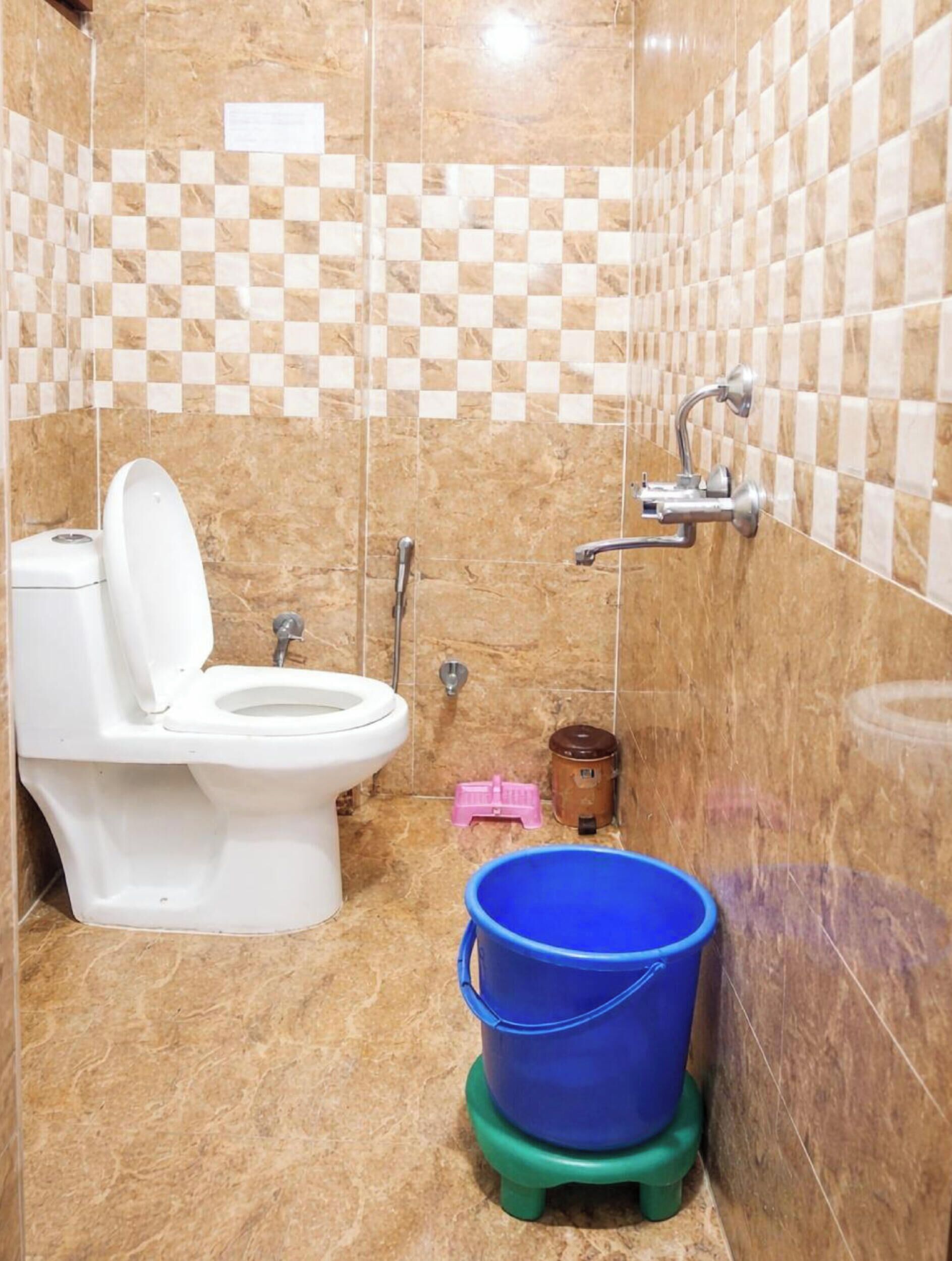 Shower, rainfall showerhead, slippers, towels