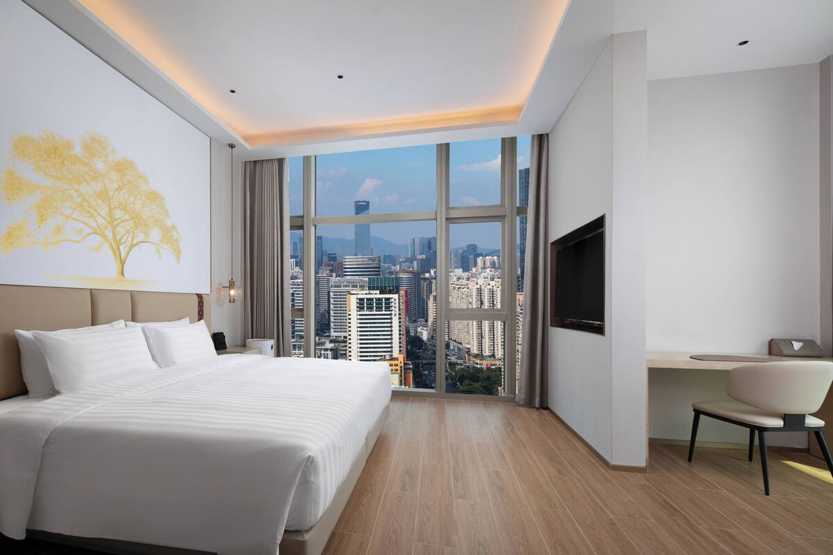 Habitación doble Confort, 1 cama King size, vista parcial al océano | Escritorio