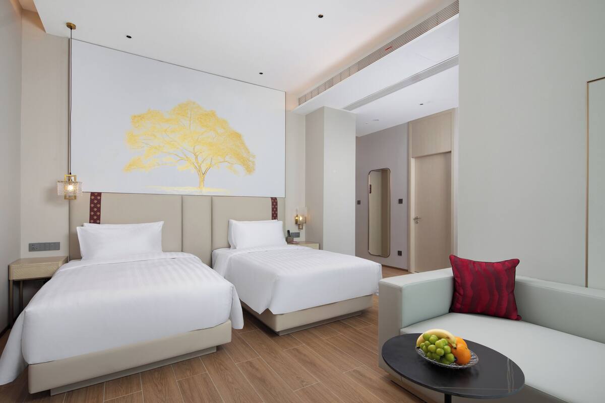 Habitación Confort con 2 camas individuales, varias camas, vista parcial al océano | Escritorio