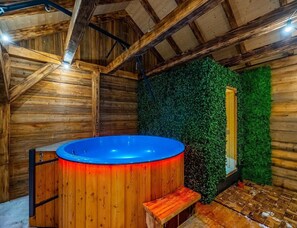 A wooden cabin interior with a hot tub, wooden walls, and a green wall feature. - Stylish Highlander Holiday Home, Sauna, Jacuzzi (Poronin)