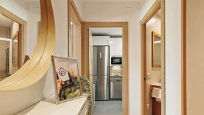 A modern kitchen with stainless steel appliances, a microwave, and a dishwasher. - Enjoy Apartments Paz 2 - Bright apartment near Sagrada Familia (Barcelona)