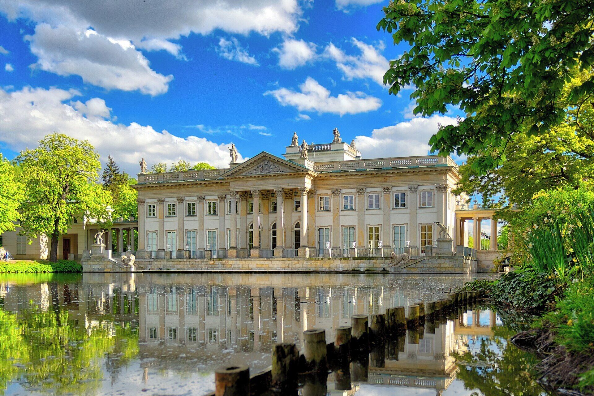 A classical building with a symmetrical facade, large windows, and a central entrance.