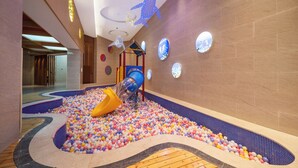 A children's play area with a slide, ball pit, and colorful wall decorations. - LANDISON HUABIN HOT-SPRING HOTEL SHAANXI (Baoji)