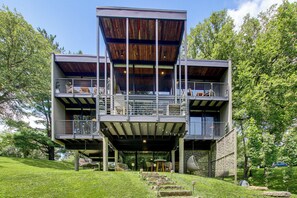 A modern multi-level building with outdoor seating and a covered area. - Award-Winning Mr Mid-Modern-Century (Iowa City)