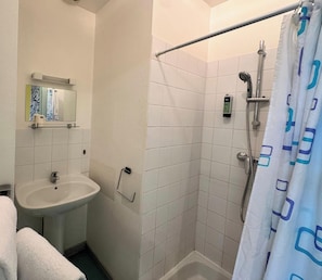 A bathroom with a shower, a sink, and a mirror. - Room 107 - Le Bas Mont Residence (Moulay)