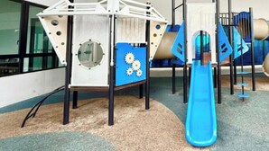 A children's play area with a slide and climbing structures. - I-City Shah Alam Residences By Asdeh (Shah Alam)