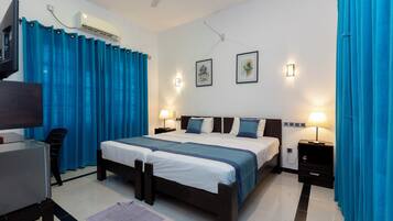 Deluxe Double Room, Garden View | In-room safe, desk, blackout drapes, iron/ironing board (on request)