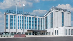A large, modern hotel building with a prominent entrance and multiple flags. - Fairfield by Marriott Urumqi Beijing Road (Urumqi)