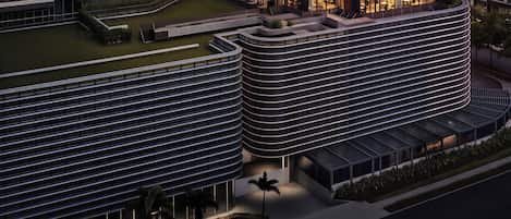 A multi-story hotel with a prominent signage indicating 'FOUR POINTS BY SHERATON'.