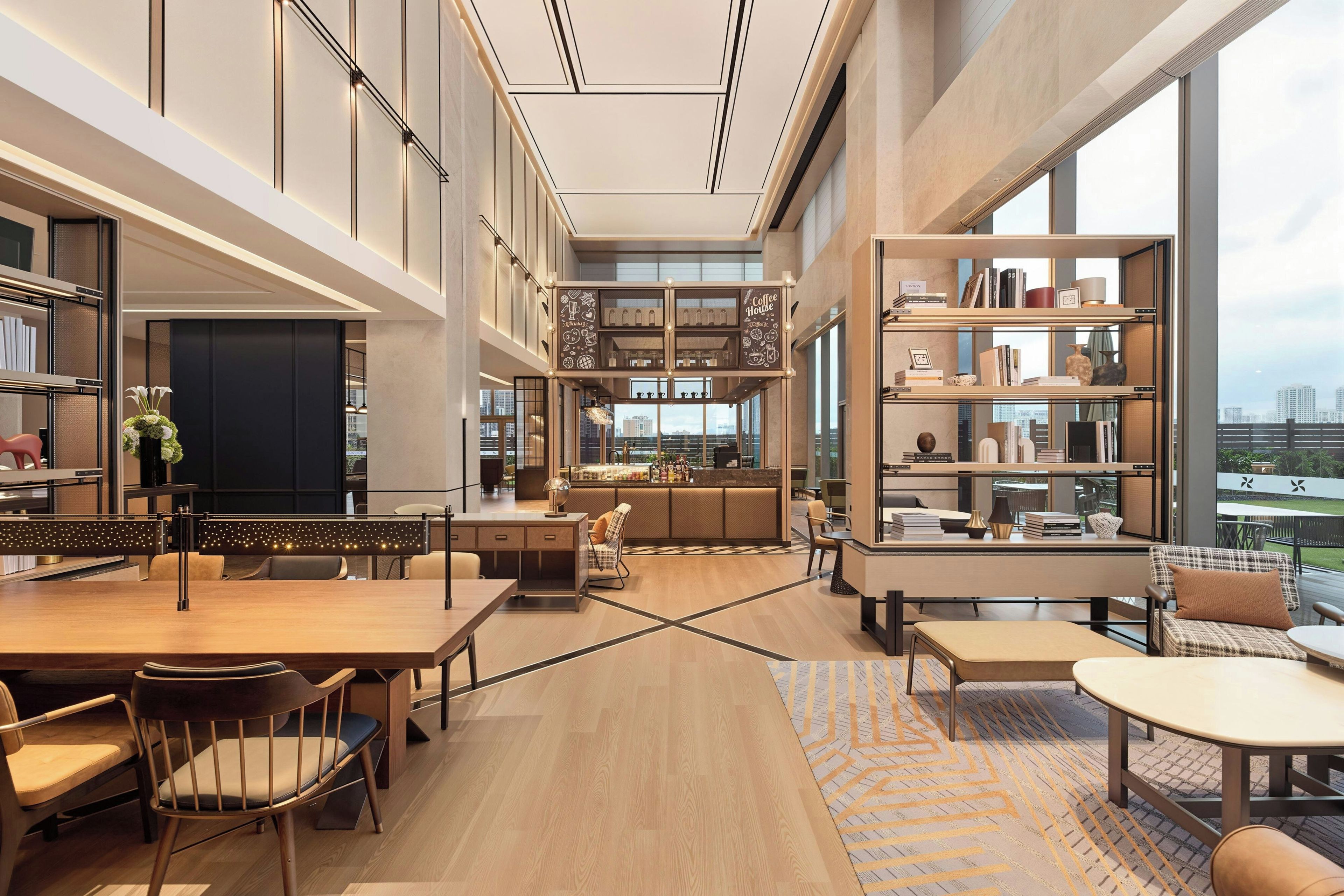 A spacious hotel lobby with a central bar area, seating arrangements, and a large window offering a city view.