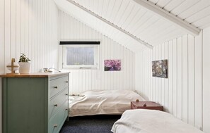 A bedroom with a single bed, a dresser, a window, and two wall-mounted paintings. - 3 bedroom lovely home in Dronningmølle (Dronningmølle)