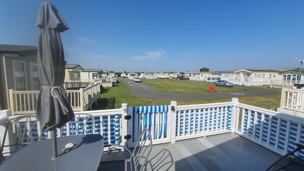 A view of a caravan park with multiple caravans and a clear sky.