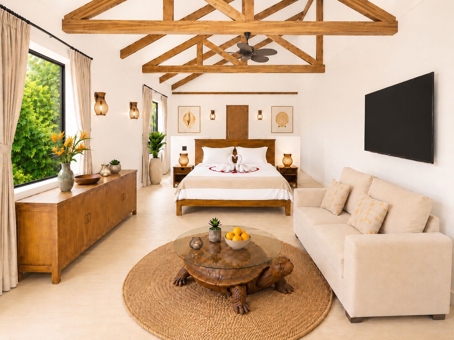 A modern hotel room with a large bed, a round coffee table with a turtle centerpiece, a sofa, and a large window with curtains.