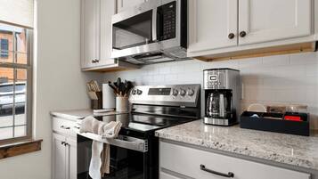 Coffee/tea maker, fridge, microwave, oven