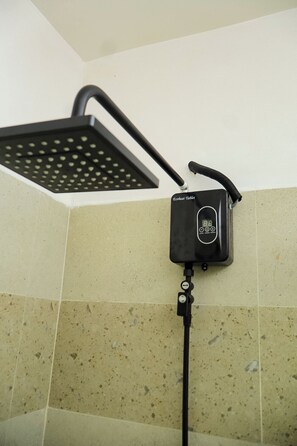 A shower with a handheld rainhead and a control panel labeled 'Ecoheat Tablet.' - Cosy Studio in a Quiet, Accessible Setting (Nairobi)