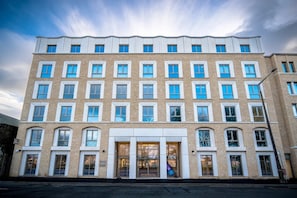 A multi-story hotel with a symmetrical facade, large windows, and a central entrance. - Student Only The Sailworks (Lancaster)