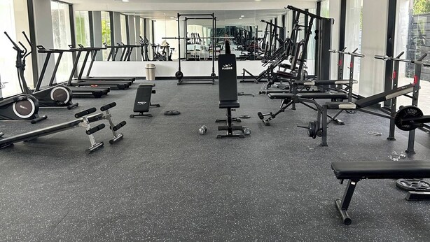 A gym with treadmills, weight machines, and free weights. - Sorelipeaceful Retreat at Green One Playa Dorada (Puerto Plata)