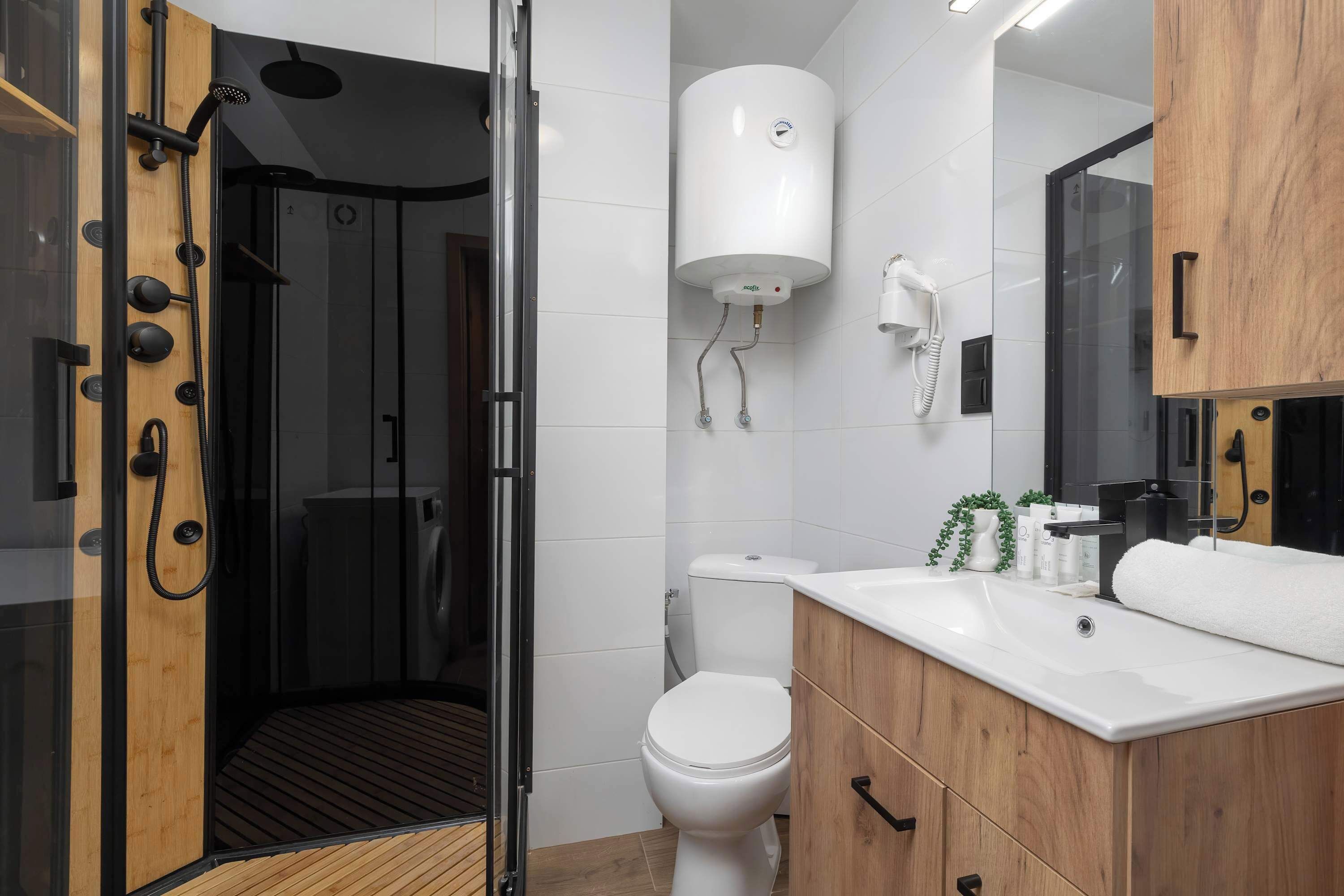 Shower, hair dryer, towels, shampoo