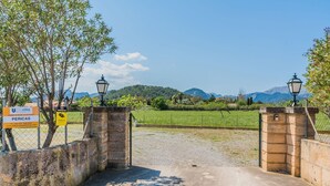 A gated entrance with a sign for 'Nordvillas' and a contact number. - Peaceful Rural Haven With Pool (Pollença)