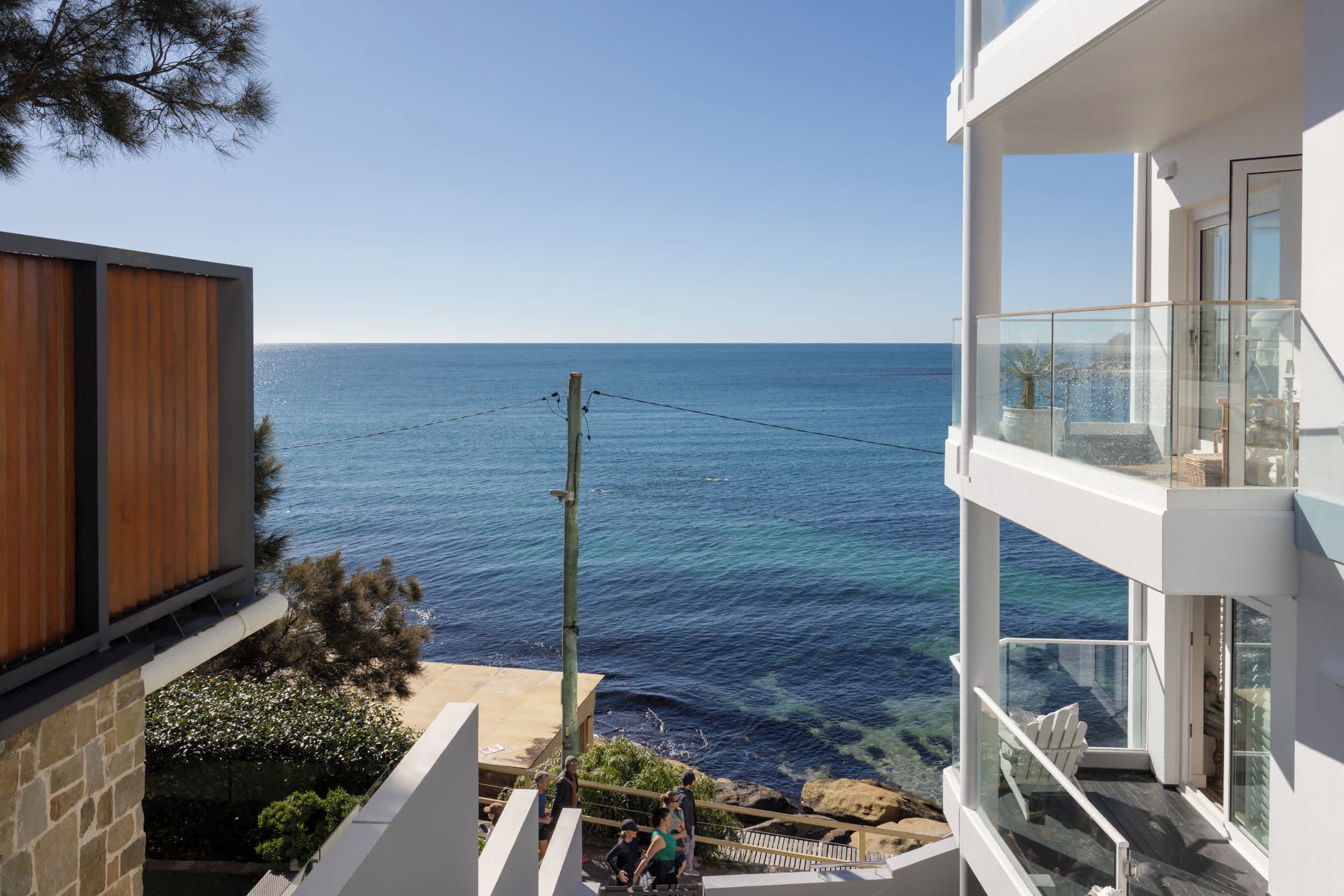 A modern building with a view of the sea.