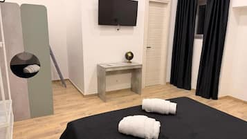 Premium Quadruple Room, Courtyard View | Desk, blackout drapes, soundproofing, iron/ironing board
