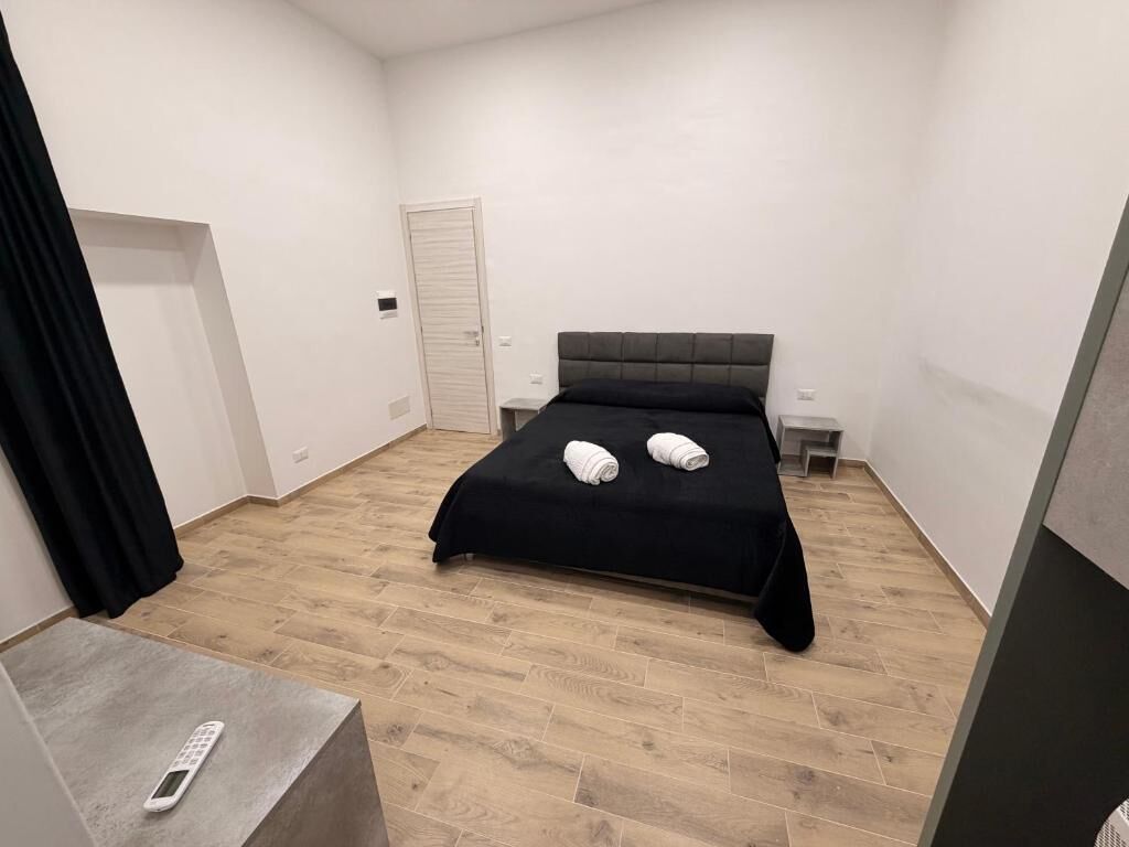 Premium Quadruple Room, Courtyard View | Desk, blackout drapes, soundproofing, iron/ironing board
